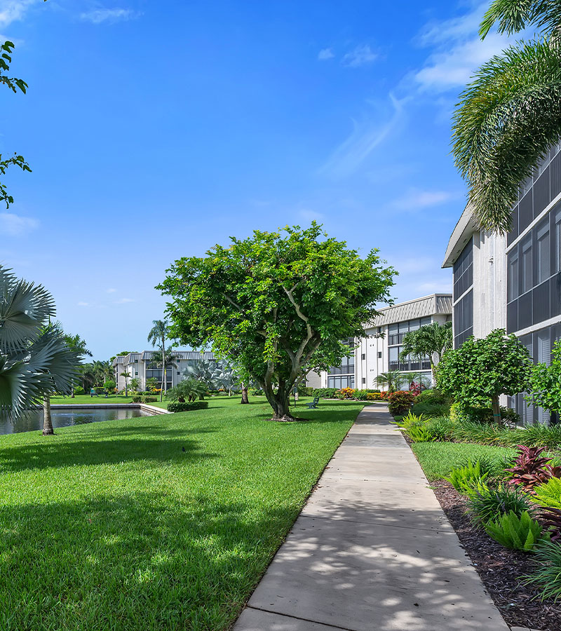 Peaceful walking path through the Hidden Lake Villas Condominiums in Naples, Florida